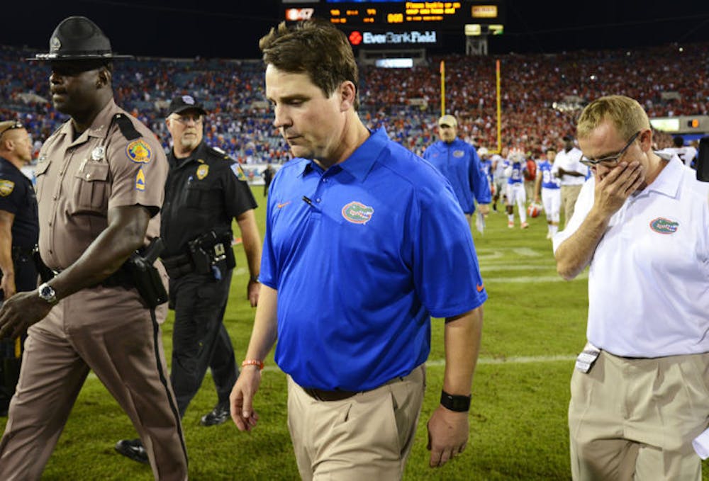 <p>Coach Will Muschamp walks off the field following Florida’s 23-20 loss to Georgia on Nov. 2 at EverBank Field in Jacksonville.</p>