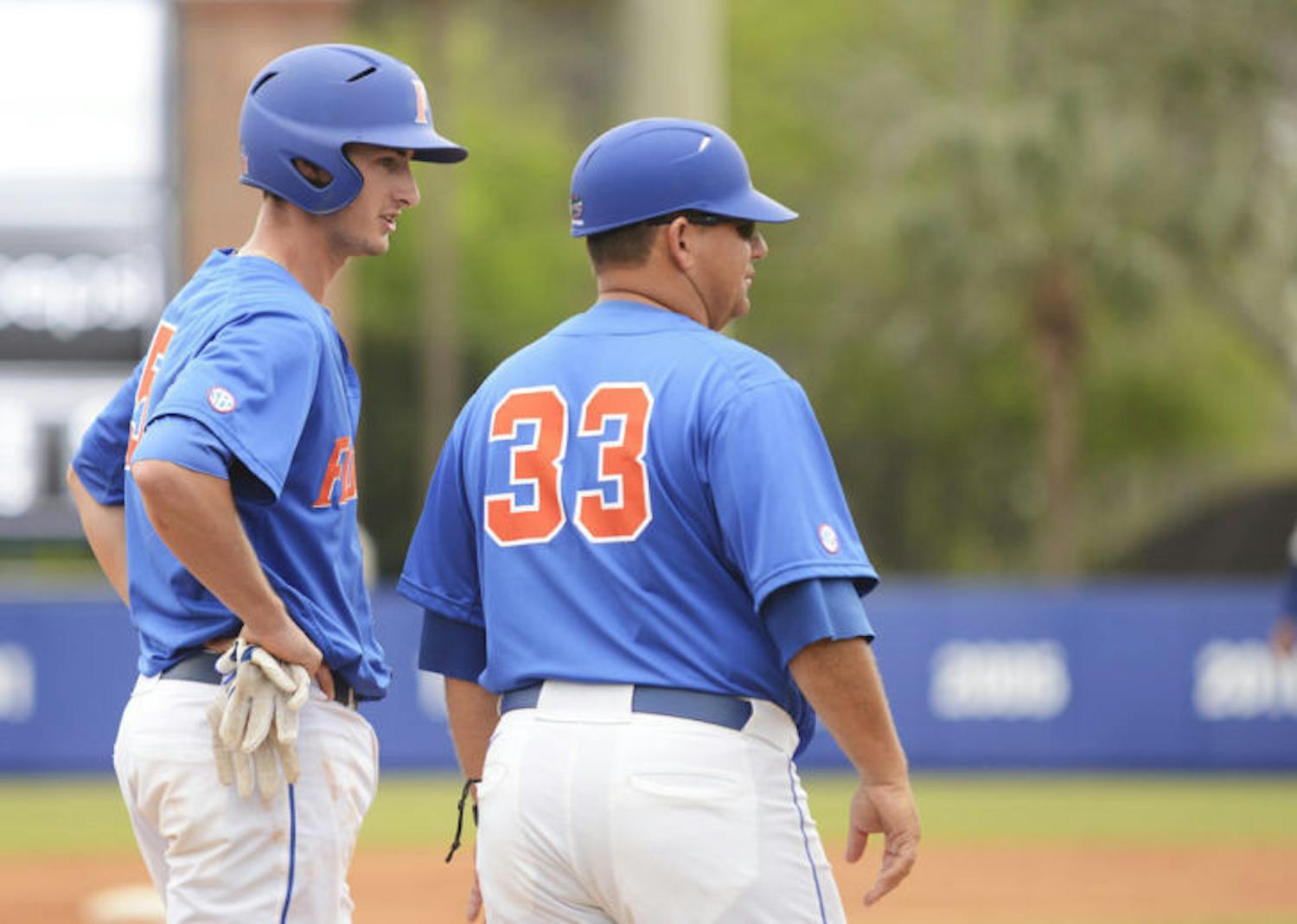 Infielder Zack Powers (5) speaks to assistant coach Craig Bell on third base during Florida’s 7-4 loss to Florida Gulf Coast on Feb. 24 at McKethan Stadium. Powers is 1 for 8 in the series against No. 10 Kentucky.