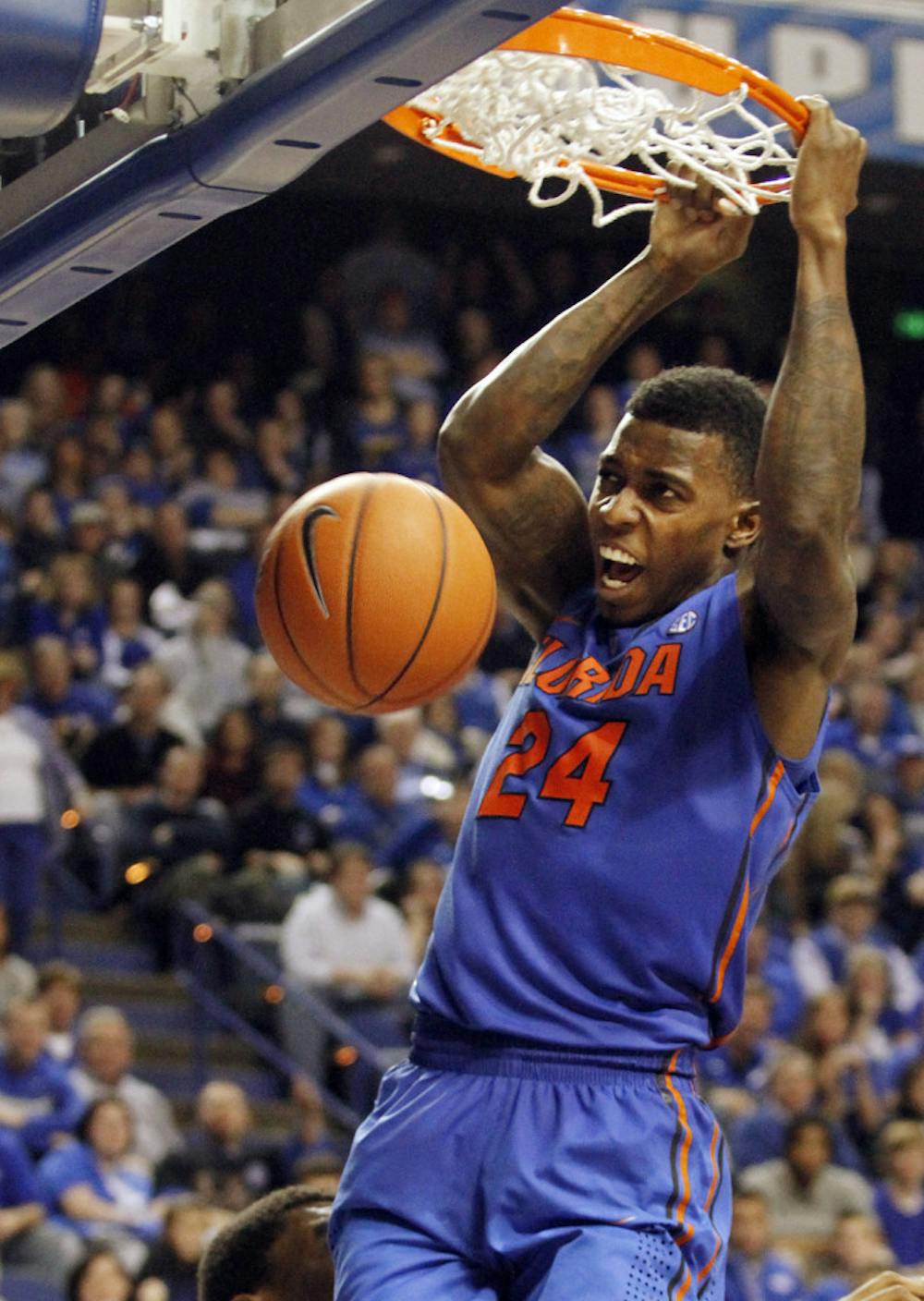 <p>Senior forward Casey Prather dunks during the second half of Florida’s 69-59 win against Kentucky on Saturday in Rupp Arena in Lexington, Ky.</p>