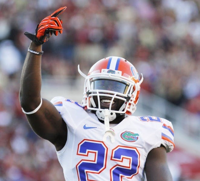 Safety Matt Elam celebrates after making a tackle in Florida’s 37-26 win against Florida State on Saturday at Doak Campbell Stadium in Tallahassee.&nbsp;
