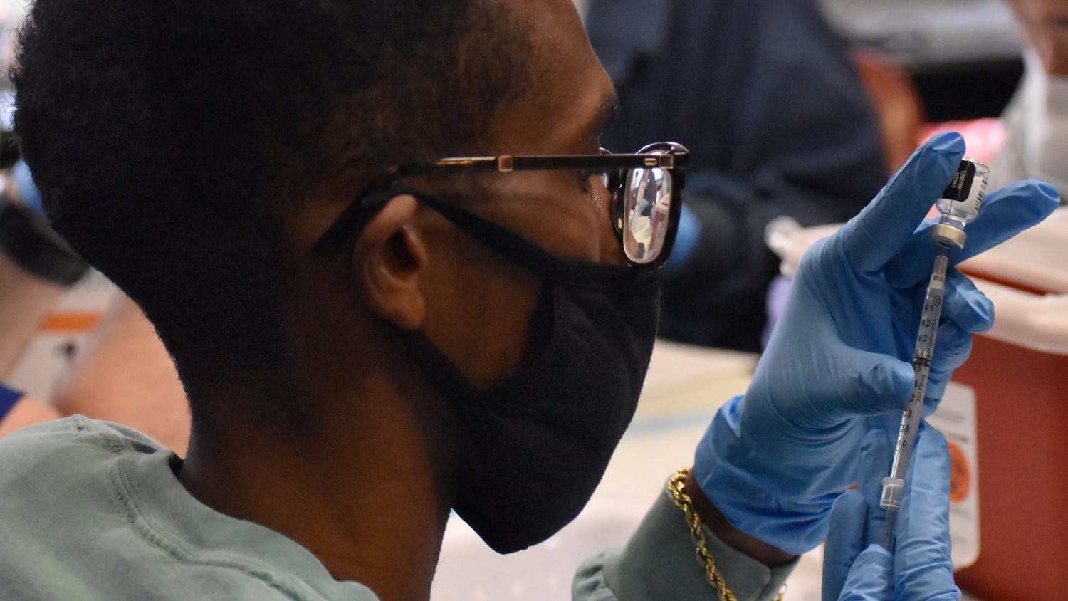 A UF pharmacy student prepares the COVID-19 vaccine before it is administered Friday, Feb.5, 2021.