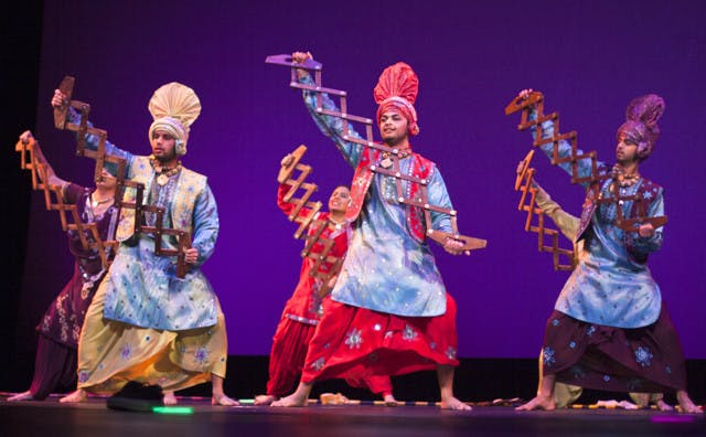 Members of Punjab Di Asli Pehchaan perform at the Indian Student Association's Diwali Show on Saturday night at the Curtis M. Phillips Center for the Performing Arts. The group is a competitive team of dancers from around Florida.