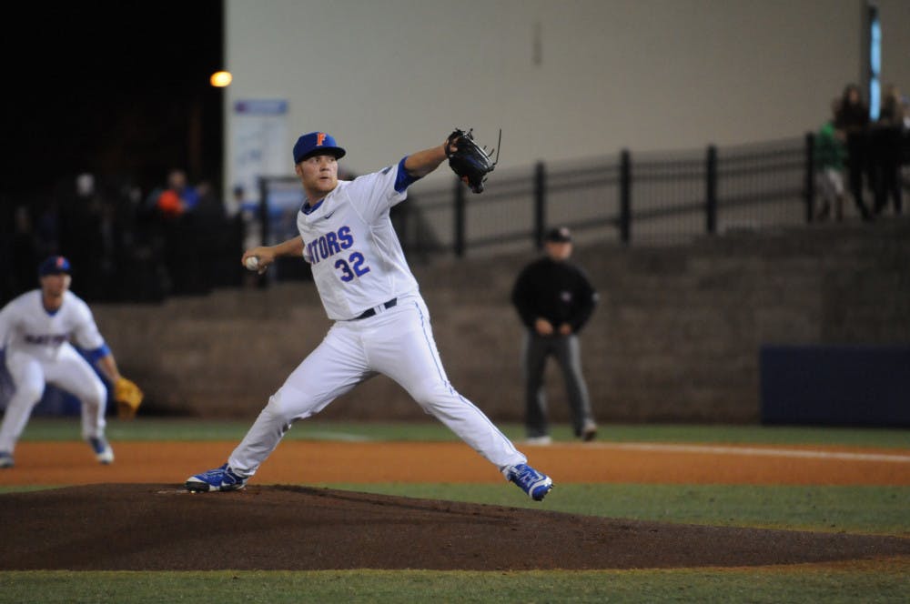 Logan Shore pitches during Florida's 4-2 win against Florida Gulf Coast on Feb. 19, 2016, at McKethan Stadium.