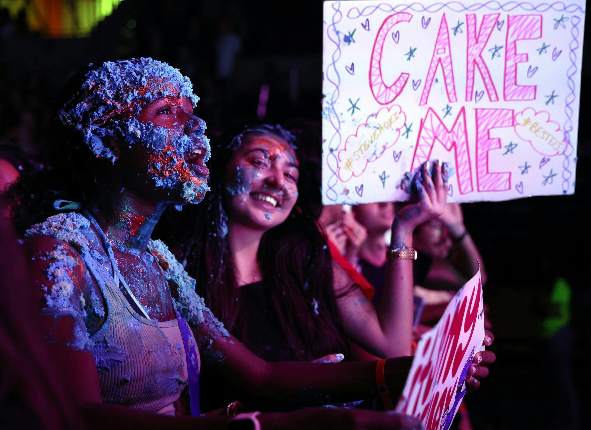 An attendee sings along to one of the final songs of the night after Steve Aoki threw a cake at her during UF’s Gator Growl at the O’Connell Center on Friday, Oct. 17, 2025.