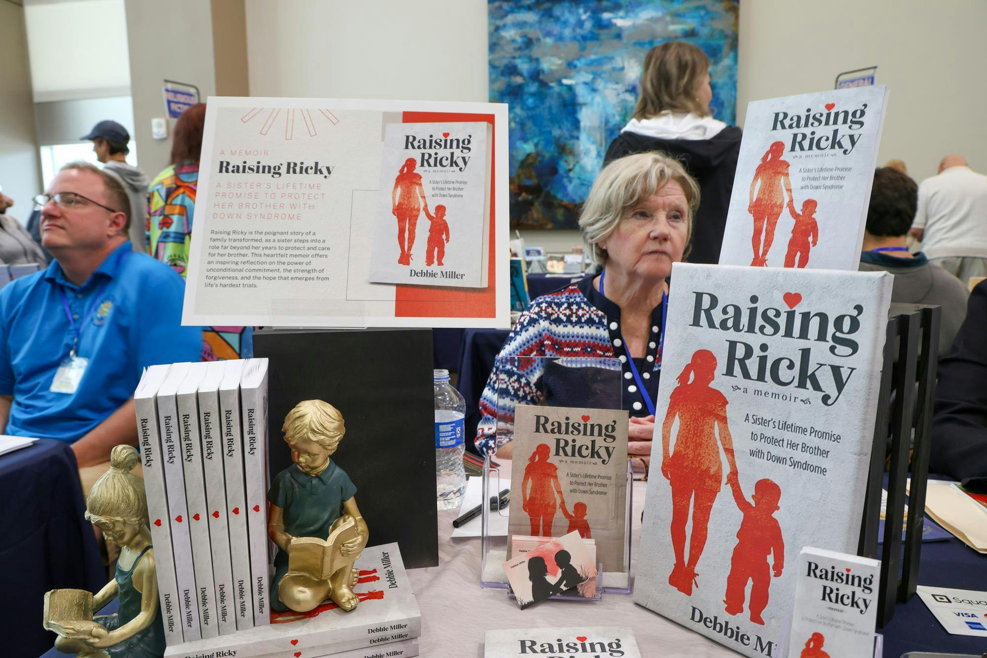 Author Debbie Miller sits at her booth during the Sunshine State Book Fair at Sante Fe College in Gainesville, Fla., Saturday, Jan. 25, 2026.