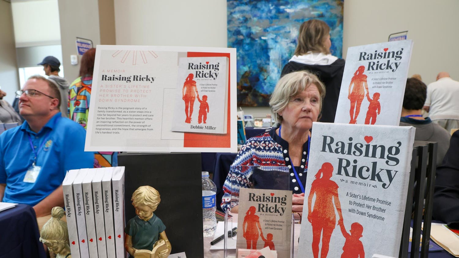 Author Debbie Miller sits at her booth during the Sunshine State Book Fair at Sante Fe College in Gainesville, Fla., Saturday, Jan. 25, 2026.