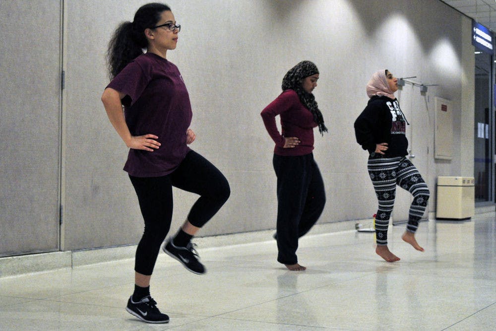 From left: Christine Diaz, a 22-year-old UF psychology senior, Bushra Rashid, a 20-year-old UF sociology junior, and Rana Al-Nahhas, a 20-year-old UF psychology sophomore, practice a dance to a portion of Beyonce's "Flawless" at the Reitz Union on Monday. They'll perform the dance at Pakistani Students' Association's 19th annual cultural show "Humara Saturday Night Live," featuring Pakistani-Dutch singer Imran Khan.​