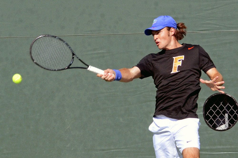 <p>Redshirt freshman Oliver Landert hits a jump-step forehand during Florida's 9-3 win against William &amp; Mary on Jan. 10 at the Ring Tennis Complex.</p>