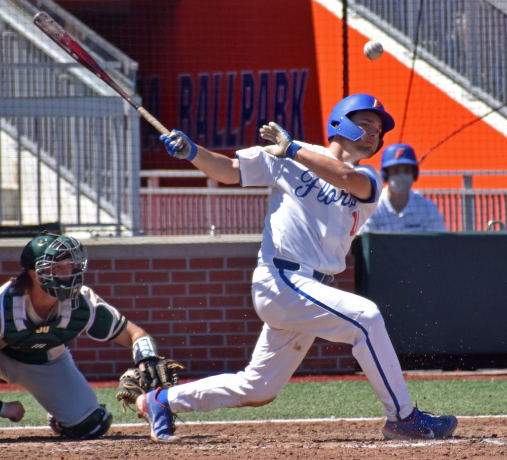 Catcher Nathan Hickey hits the ball against Jacksonville on March 14. The Gators look to sweep the Stetson Hatters Tuesday