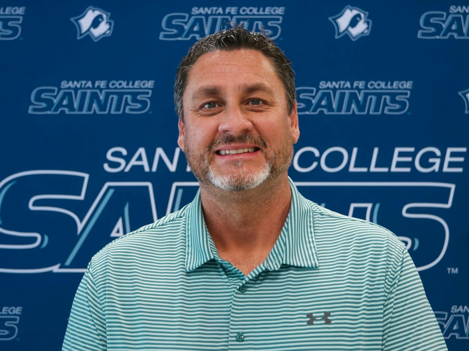 Santa Fe College's new athletic director, Greg McVey, 51, poses inside the school’s gym on Tuesday, June 1, 2021. McVey, who hails from the Midwest, said he's looking forward to working with "great people" and "great student athletes.