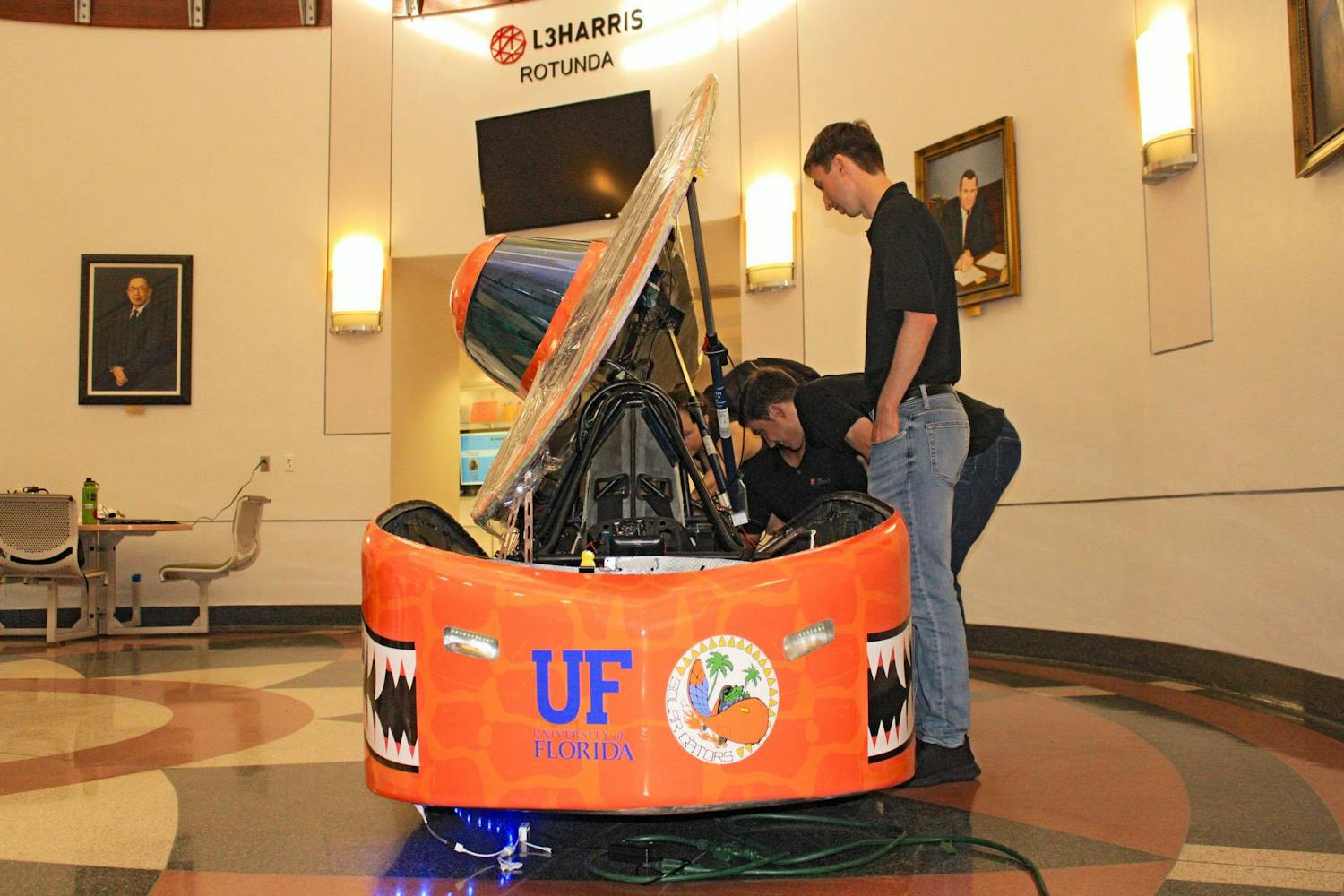 After years of hard work and engineering obstacles, the Solar Gators revealed their newest solar-powered car at UF’s New Engineering Building Thursday. The car is set to compete at the Formula Sun Grand Prix at Topeka, Kansas, throughout the week.&nbsp;
Designed and assembled completely by UF students, the “Sunrider” can reach speeds up to 50 mph, and a single battery pack can power it through 200 miles.&nbsp;
The week-long competition consists of four days of scrutineering, where experts test and inspect every piece of the vehicle, followed by three days of racing. It’s a race of endurance where previous winners reached 700 miles through multiple battery packs. The team will compete against 14 other groups from across the United States and Canada. Irene Chung, president-elect of Solar Gators, said winning this competition will qualify them for larger competitions such as the American Solar Challenge. However, more hurdles await them at the racetrack, she said.&nbsp;
“As you start driving,” she said, “you start seeing things that you’ve never seen before, and you’ve got to debug and problem solve on the fly.”
