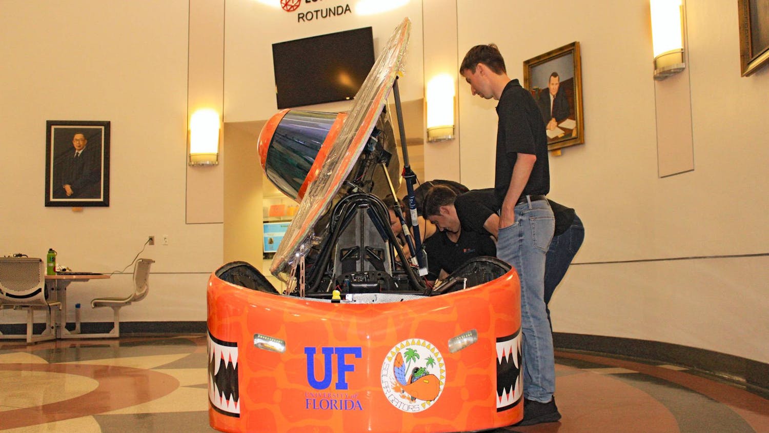 After years of hard work and engineering obstacles, the Solar Gators revealed their newest solar-powered car at UF’s New Engineering Building Thursday. The car is set to compete at the Formula Sun Grand Prix at Topeka, Kansas, throughout the week.&nbsp;
Designed and assembled completely by UF students, the “Sunrider” can reach speeds up to 50 mph, and a single battery pack can power it through 200 miles.&nbsp;
The week-long competition consists of four days of scrutineering, where experts test and inspect every piece of the vehicle, followed by three days of racing. It’s a race of endurance where previous winners reached 700 miles through multiple battery packs. The team will compete against 14 other groups from across the United States and Canada. Irene Chung, president-elect of Solar Gators, said winning this competition will qualify them for larger competitions such as the American Solar Challenge. However, more hurdles await them at the racetrack, she said.&nbsp;
“As you start driving,” she said, “you start seeing things that you’ve never seen before, and you’ve got to debug and problem solve on the fly.”