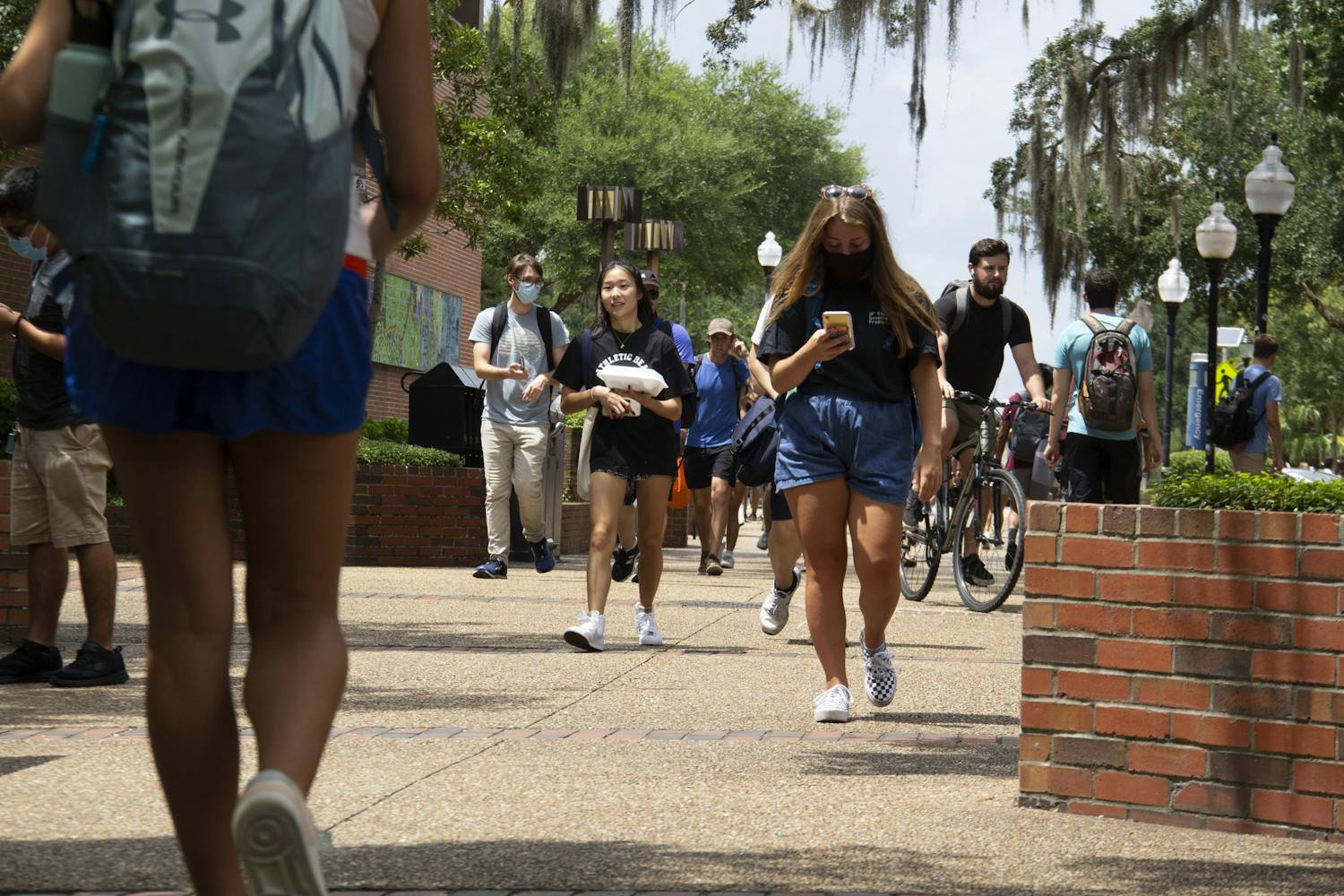 Students walk through Turlington Plaza in between classes on Monday, Aug. 23, 2021. Monday marked the beginning of the Fall semester at UF. 