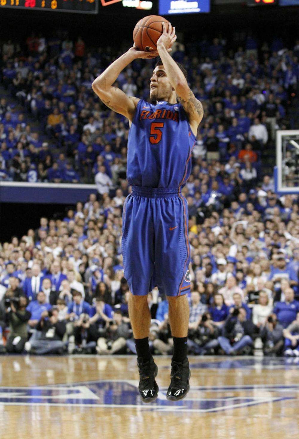 <p>Scottie Wilbekin shoots an uncontested three-point shot during Florida’s 69-59 win against Kentucky on Saturday in Lexington, Ky. Wilbekin scored a career-high 23 points in the win, which was the Gators’ first in Rupp Arena since 2007.</p>