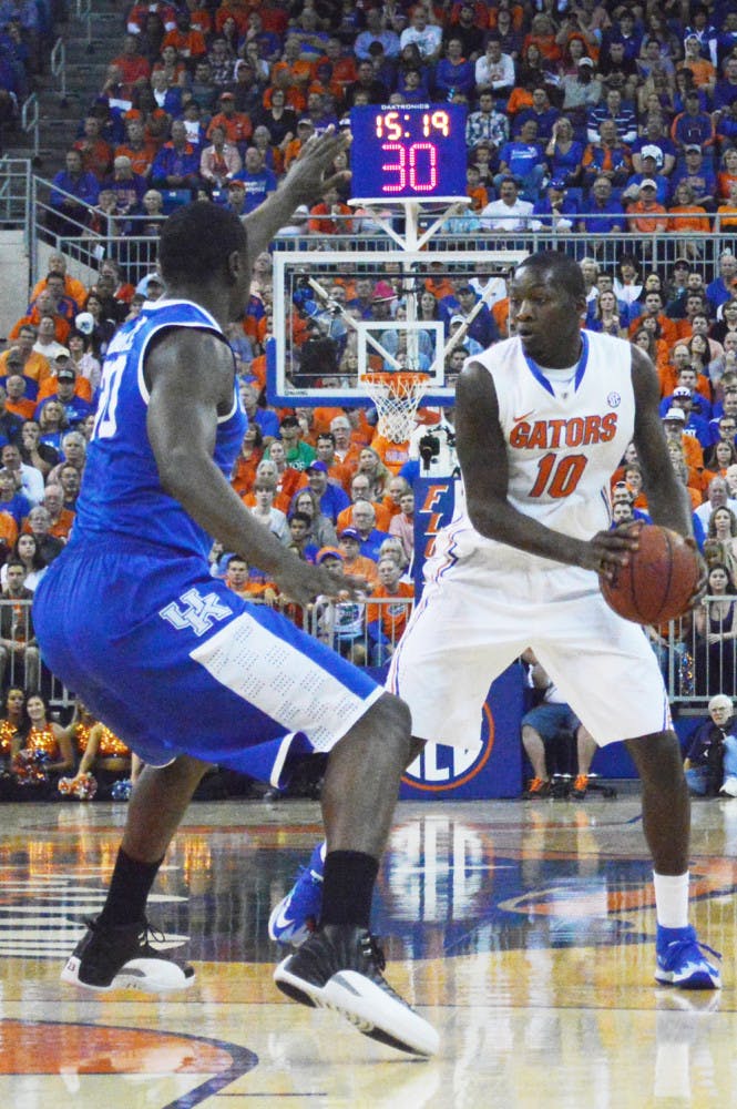 Dorian Finney-Smith fakes out Kentucky’s Julius Randle during UF’s 84-65 win against UK on Saturday in the O’Connell Center.