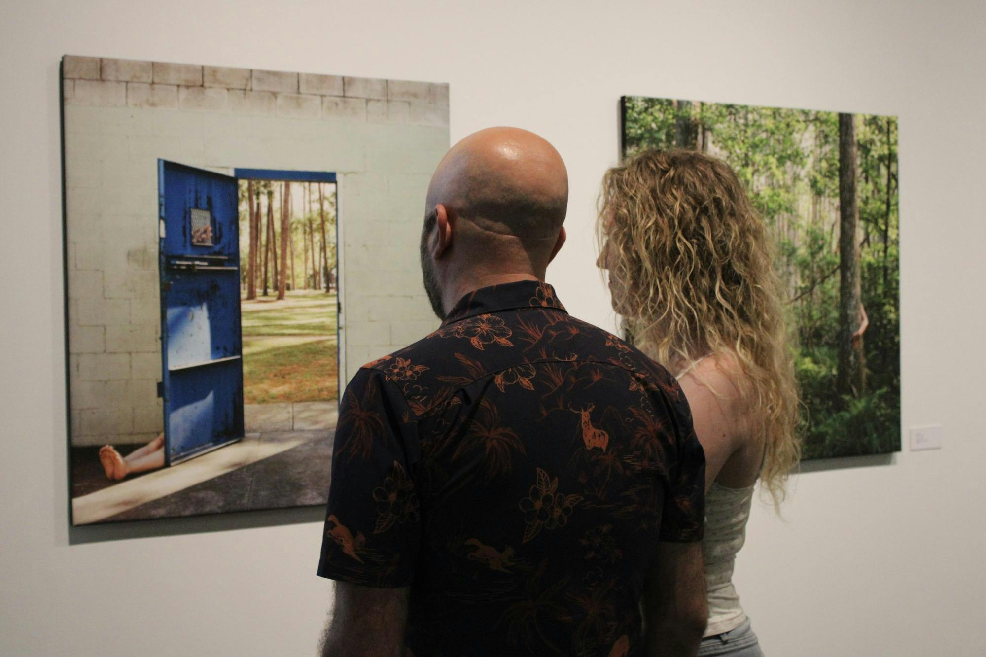 Gainesville residents visit the Gainesville Fine Arts Association to view Jessica Carter's “Florida Woman” exhibition on Saturday, July 31, 2026.