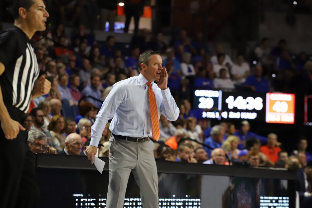 Mike White yells calls during a game during the 2019-20 season.