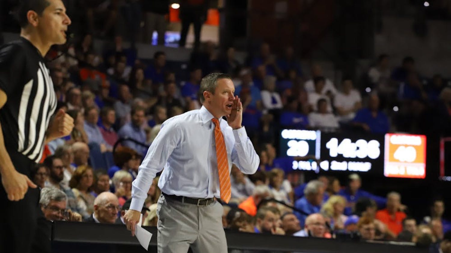 Mike White yells calls during a game during the 2019-20 season.