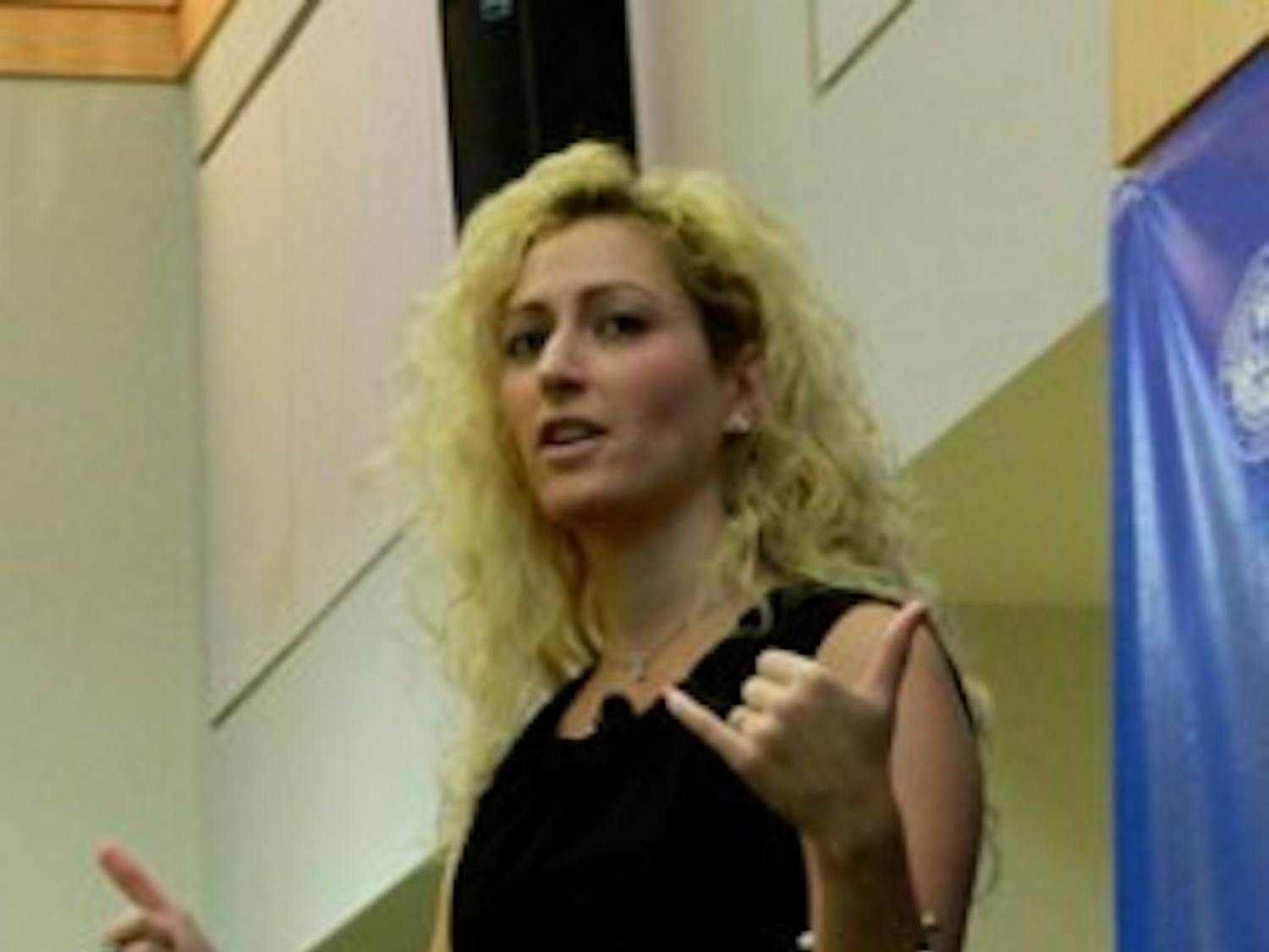 Jane McGonigal urged students to spend more time playing online video games. She stressed the positive effects that playing games have on people.