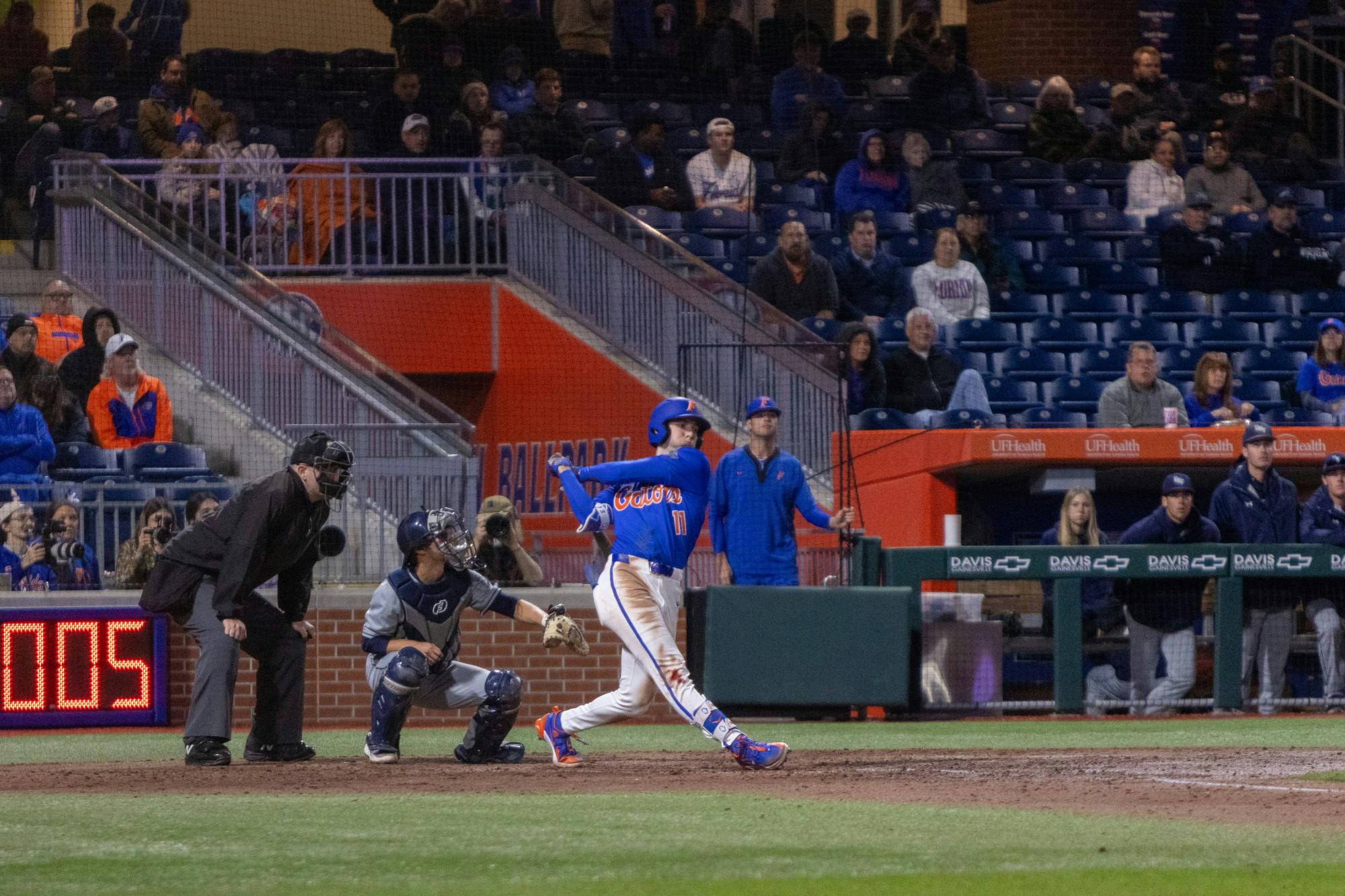 Florida baseball sophomore Michael Robertson follows through on a swing in the team's 13-4 win over UNF on Wednesday, February 21, 2024. 
