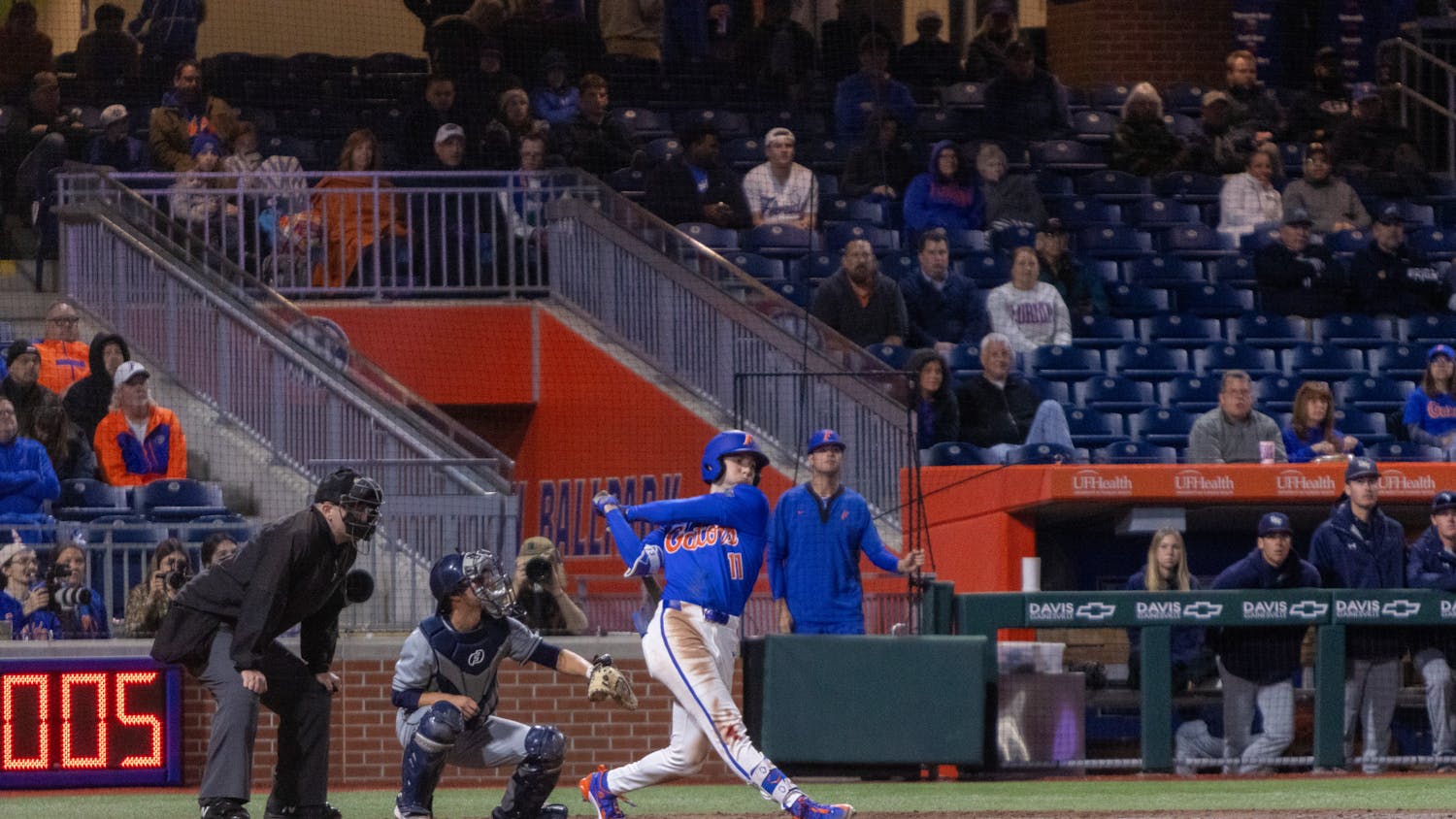 Florida baseball sophomore Michael Robertson follows through on a swing in the team's 13-4 win over UNF on Wednesday, February 21, 2024. 