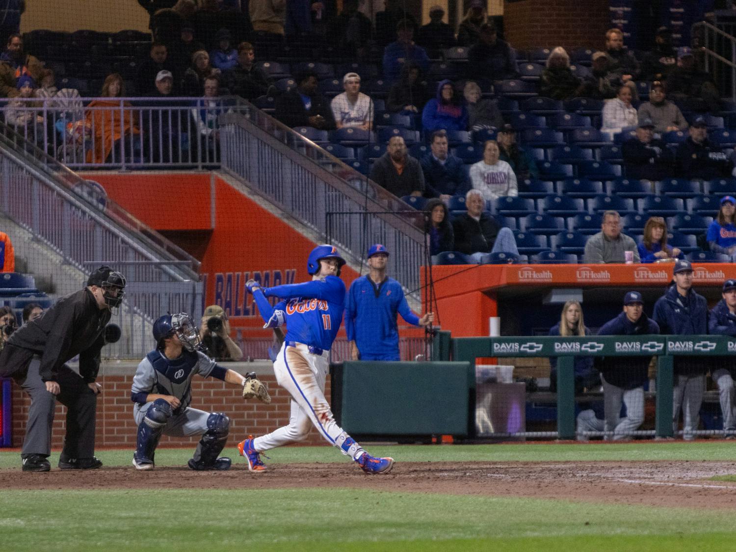 Florida baseball sophomore Michael Robertson follows through on a swing in the team's 13-4 win over UNF on Wednesday, February 21, 2024. 
