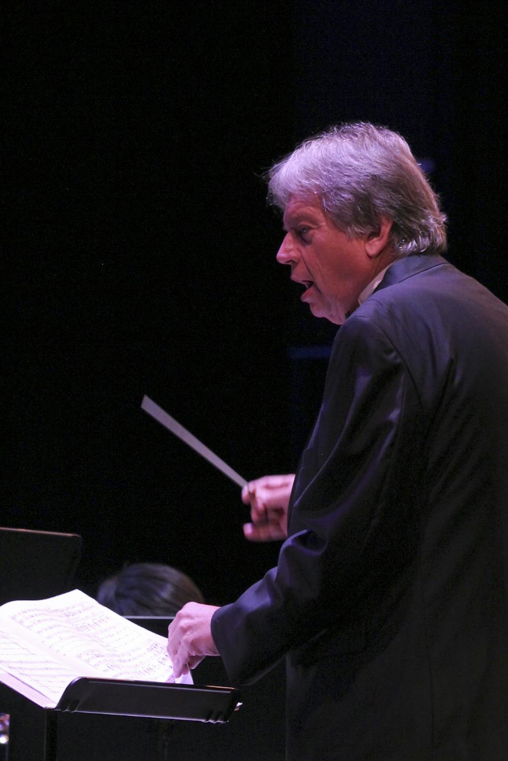 Steven Bingham conducts the Santa Fe wind and percussion ensemble at the ninth annual Winds and the Classics concert in the Santa Fe College fine arts hall Oct. 1, 2015. The ensembles played a variety of songs including the Washington Post March, America the Beautiful and a tribute to David Gorham.