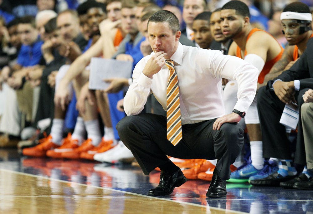 <p>Florida's head coach Mike White watches his team during the second half of an NCAA college basketball game against Kentucky, Saturday, Feb. 6, 2016, in Lexington, Ky. Kentucky won 80-61. (AP Photo/James Crisp)</p>