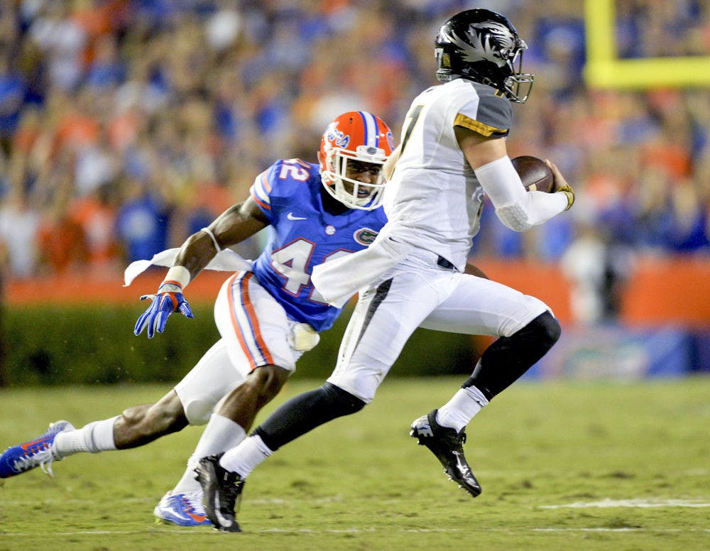 Sophomore defensive back Keanu Neal makes a run at Missouri quarterback Maty Mauk during Florida's 42-13 loss to Missouri on Saturday at Ben Hill Griffin Stadium.