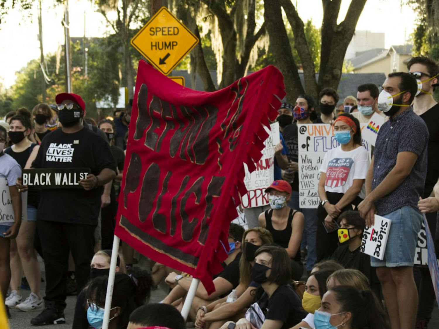 Organizers explain the gentrification of the Pleasant Street area at the third stop of the protest at A. Quinn Jones Museum and Cultural Center. Danielle Chanzes, a volunteer for the Gainesville Alliance for Equitable Development, said that after Seminary Lane apartments were torn down in 2009, hundreds of Black residents were promised affordable housing as a replacement, but no progress had been made since then.
