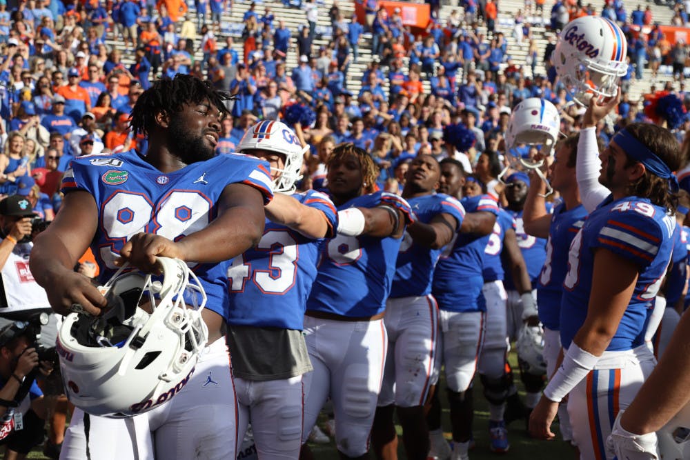 <p>The Gators celebrating a home win against Vanderbilt last season. In Saturday's opening kickoff, the Gators and Rebels displayed their support of the Black Lives Matter movement.</p>