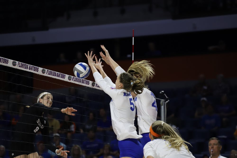 Florida's Rachel Kramer and Holly Carlton go for a block in a 2019 game against Texas A&M.