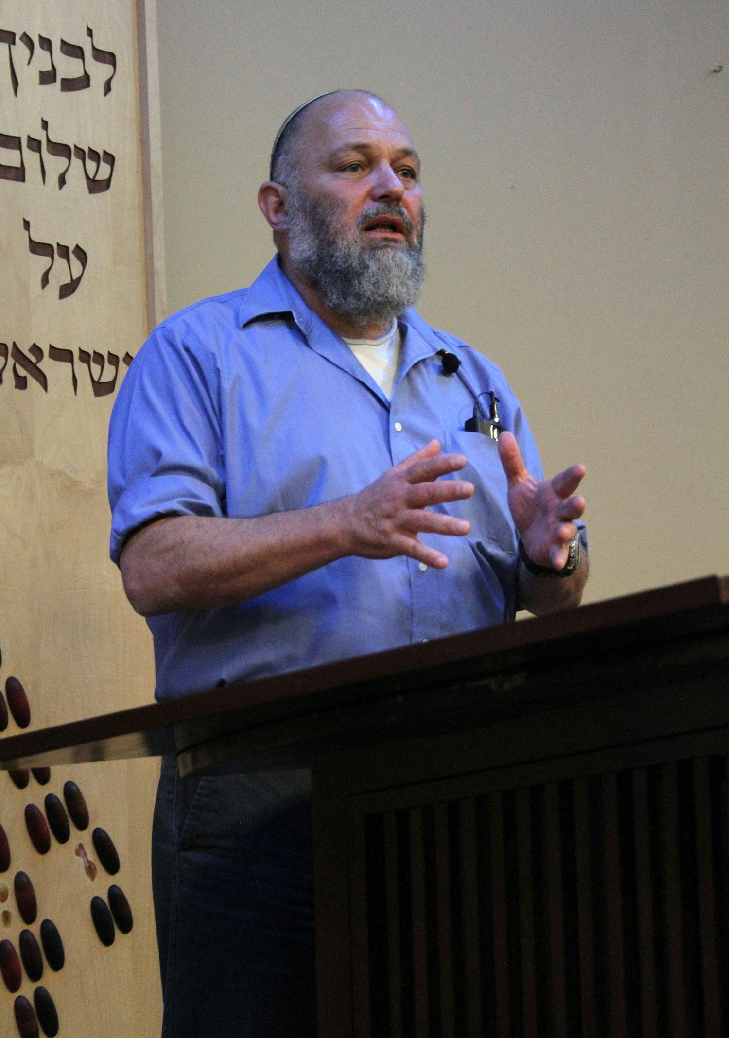 Effie Eitam, consultant and adviser on infrastructure and energy matters in Israel and overseas, talks to a group of students at Hillel Thursday night.