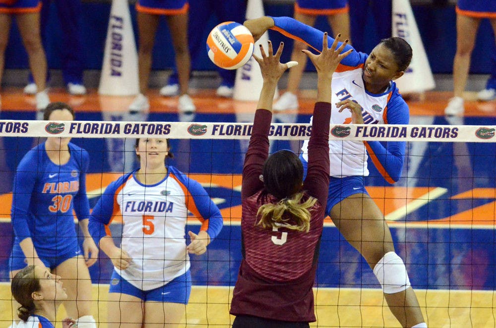 <p>Rhamat Alhassan swings for a kill attempt during Florida's 3-0 win against Mississippi State.</p>