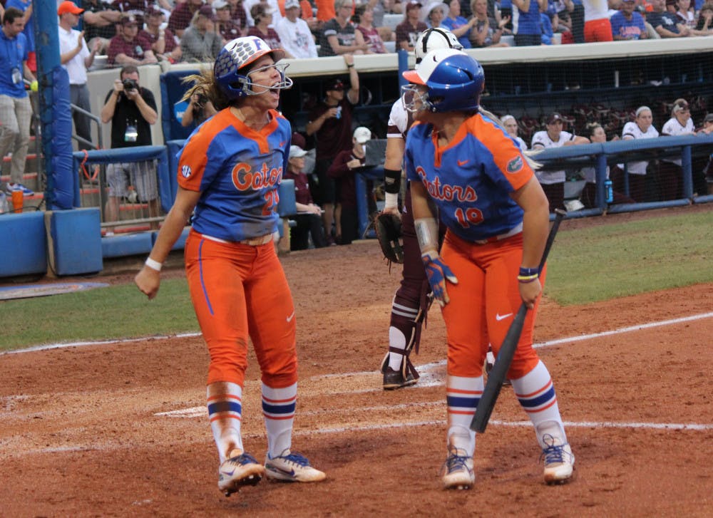 <p><span id="docs-internal-guid-41e1c4e0-aac8-87f9-0bf2-7cc94d46fba5"><span>Senior third baseman Nicole DeWitt (left) and junior right fielder Amanda Lorenz (right) celebrate after scoring runs against Texas A&amp;M on Friday. They and the No. 4 Gators will face No. 9 Georgia at the Women’s College World Series in Oklahoma City.</span></span></p>