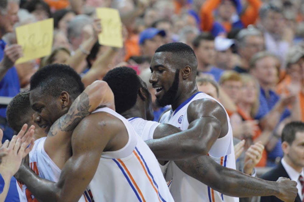 <p class="p1">Gators basketball seniors Scottie Wilbekin, Will Yeguete, Casey Prather and Patric Young embrace after leaving the floor of the Stephen C. O’Connell Center for the last time during Florida’s 84-65 win against Kentucky on March 8.</p>