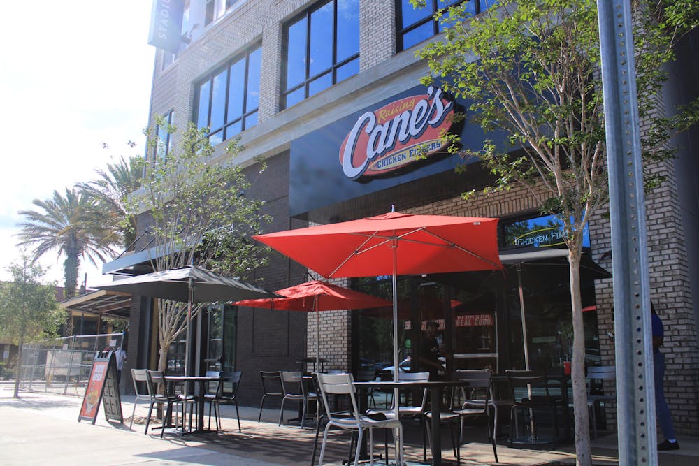 <p>The new Raising Cane’s restaurant is seen on 1680 W University Ave. on Tuesday, June 13, 2023</p>