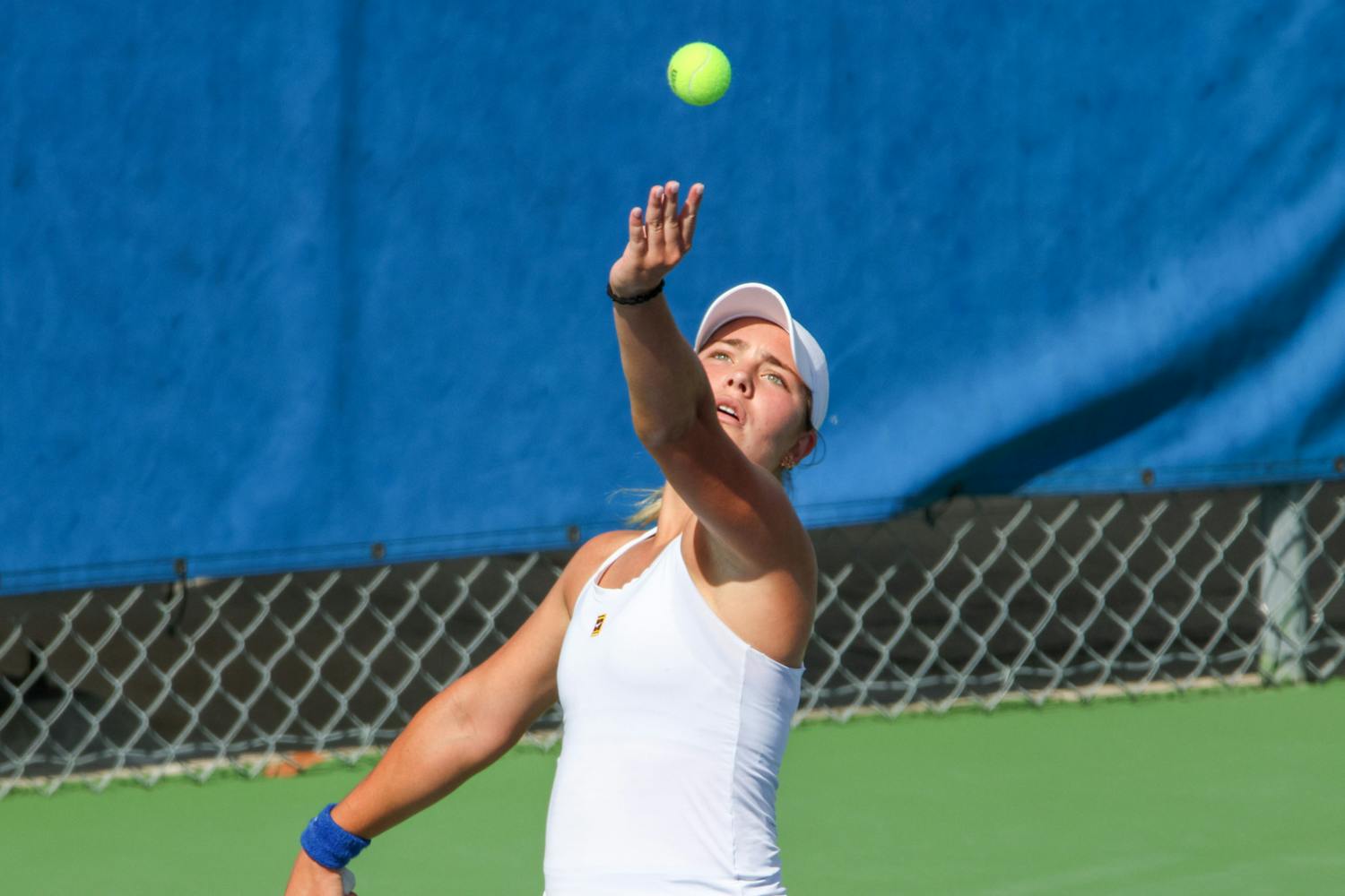 Florida freshman Rachel Gailis serves the ball during the Gators' 4-1 win against the No. 3 Michigan Wolverines Wednesday, March 22, 2023.