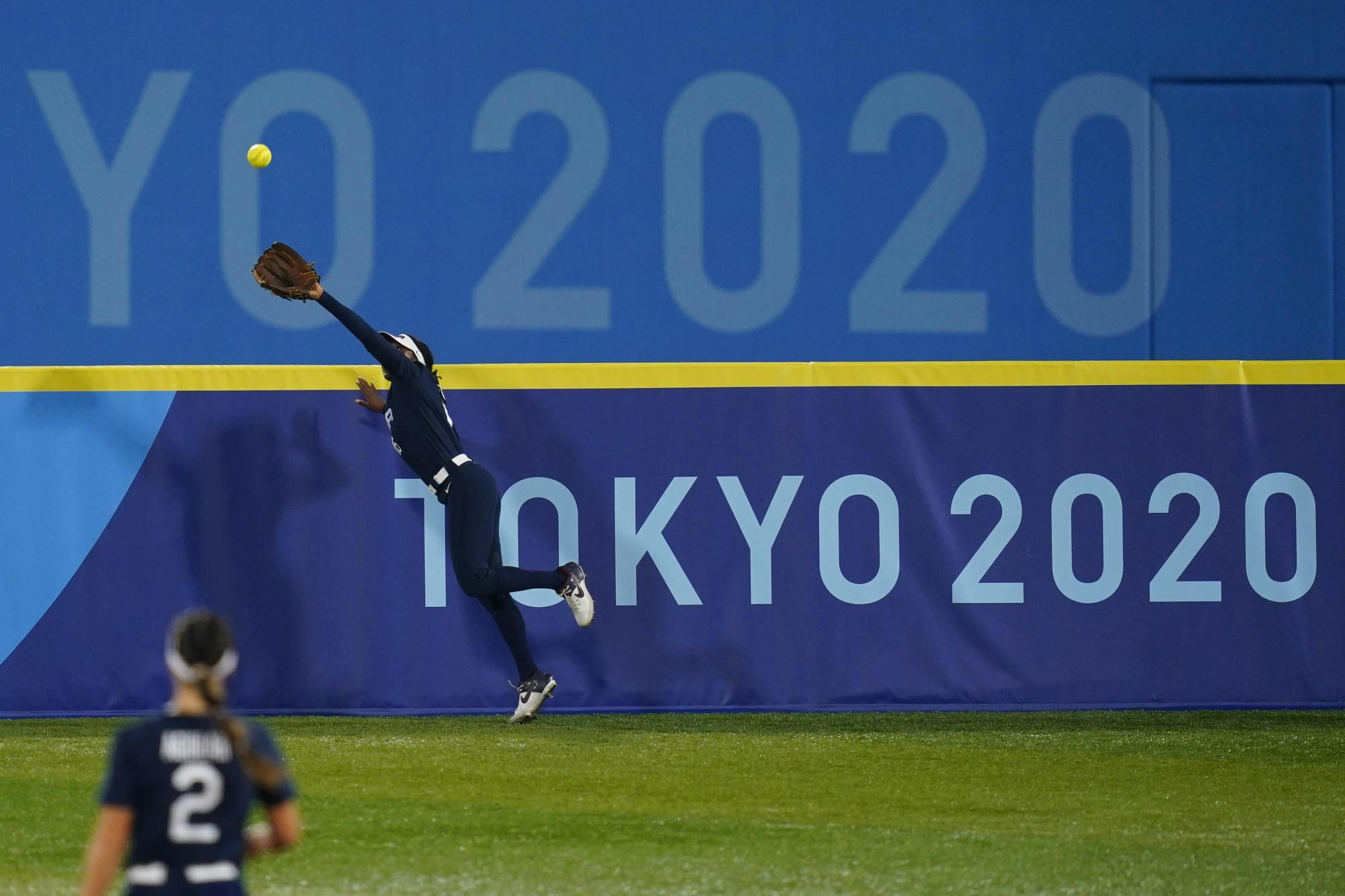 United States' Michelle Moultrie catches a fly out during a softball game against Japan at the 2020 Summer Olympics, Tuesday, July 27, 2021, in Yokohama, Japan. (AP Photo/Matt Slocum)