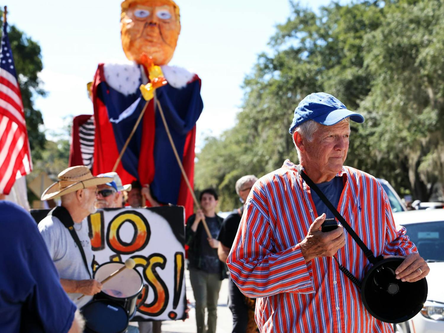 Glenn Terry leads a drum line at a "No Kings" protest on Saturday, Oct. 18, 2025, in Gainesville, Fla.