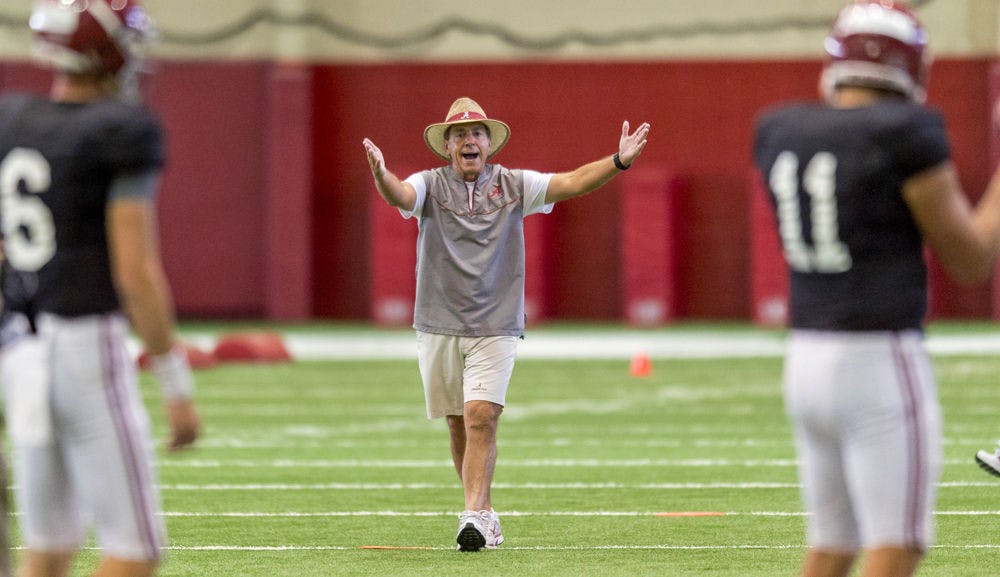 Alabama football coach Nick Saban works with his players during the NCAA college football team's practice on Sept. 1, 2015, in Tuscaloosa, Ala.