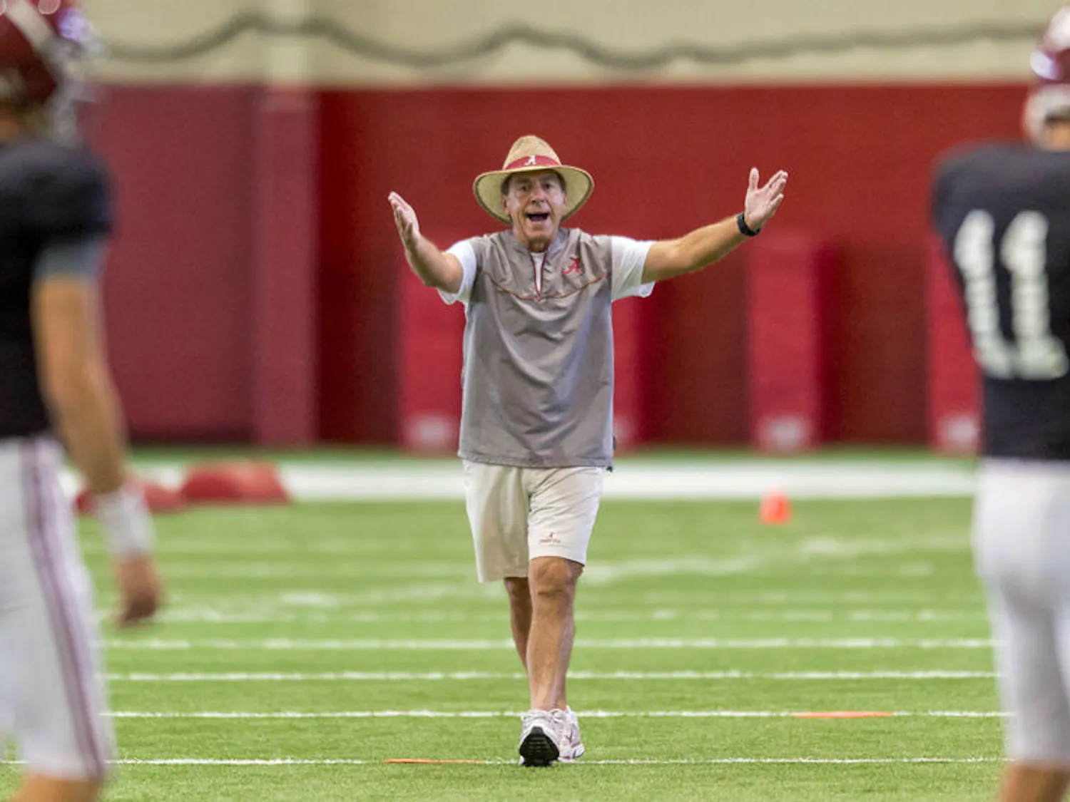 Alabama football coach Nick Saban works with his players during the NCAA college football team's practice on Sept. 1, 2015, in Tuscaloosa, Ala.