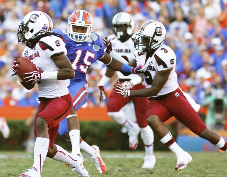 Gunner Loucheiz Purifoy (15) chases South Carolina punt returner Ace Sanders (1) during UF’s 44-11 win on Saturday at Ben Hill Griffin Stadium. Purifoy forced two fumbles in the game.
