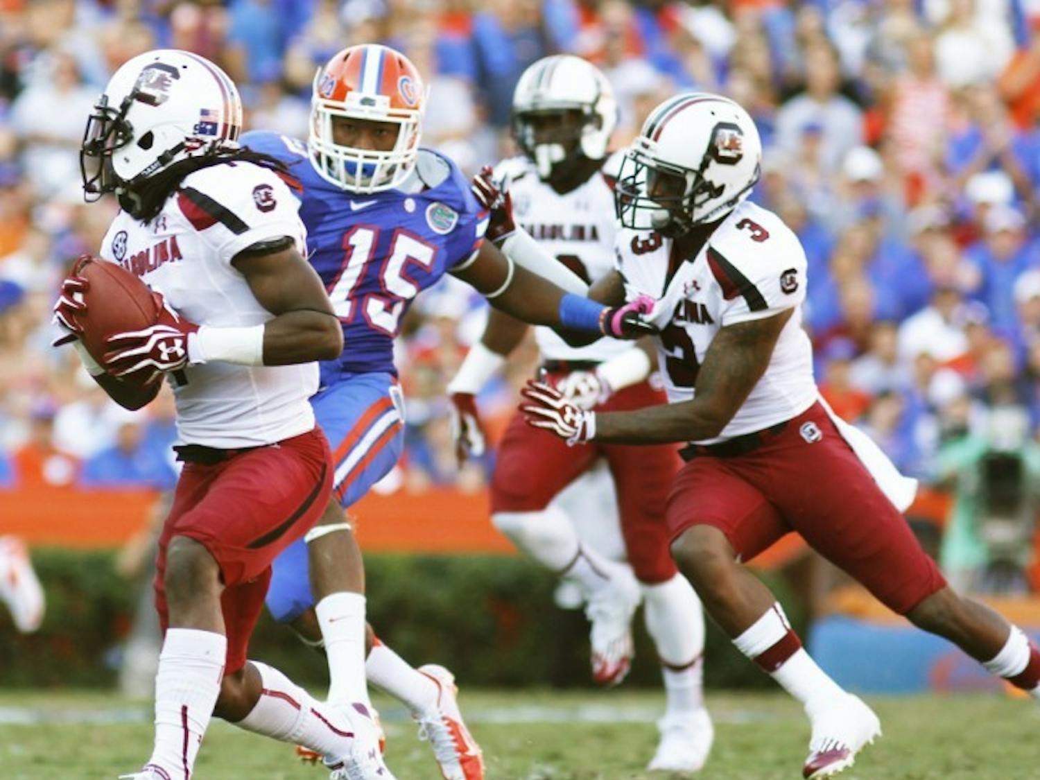 Gunner Loucheiz Purifoy (15) chases South Carolina punt returner Ace Sanders (1) during UF’s 44-11 win on Saturday at Ben Hill Griffin Stadium. Purifoy forced two fumbles in the game.
