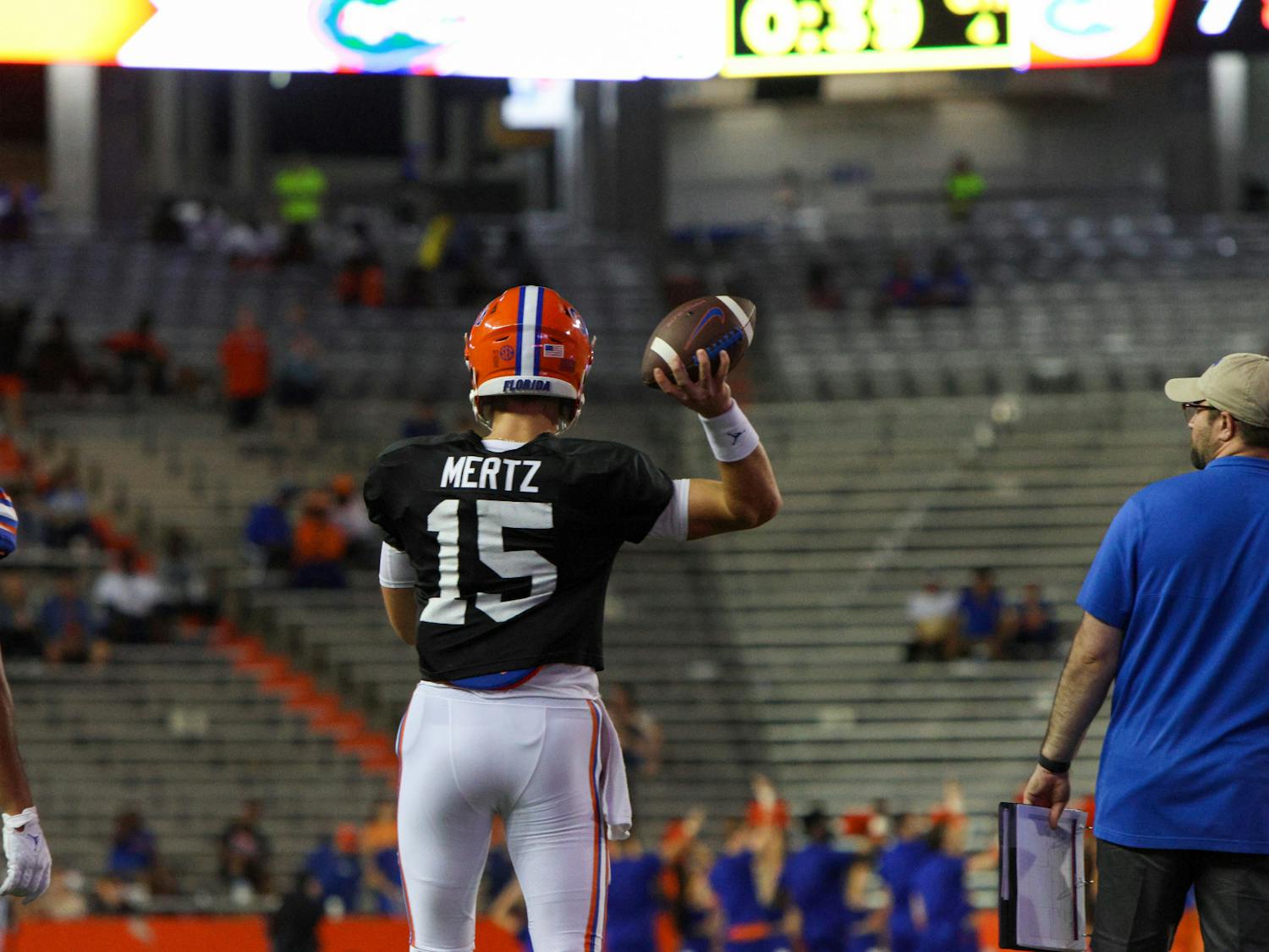 Graham Mertz attempts a pass in the Orange and Blue Spring Game Thursday, Aug. 15, 2023.