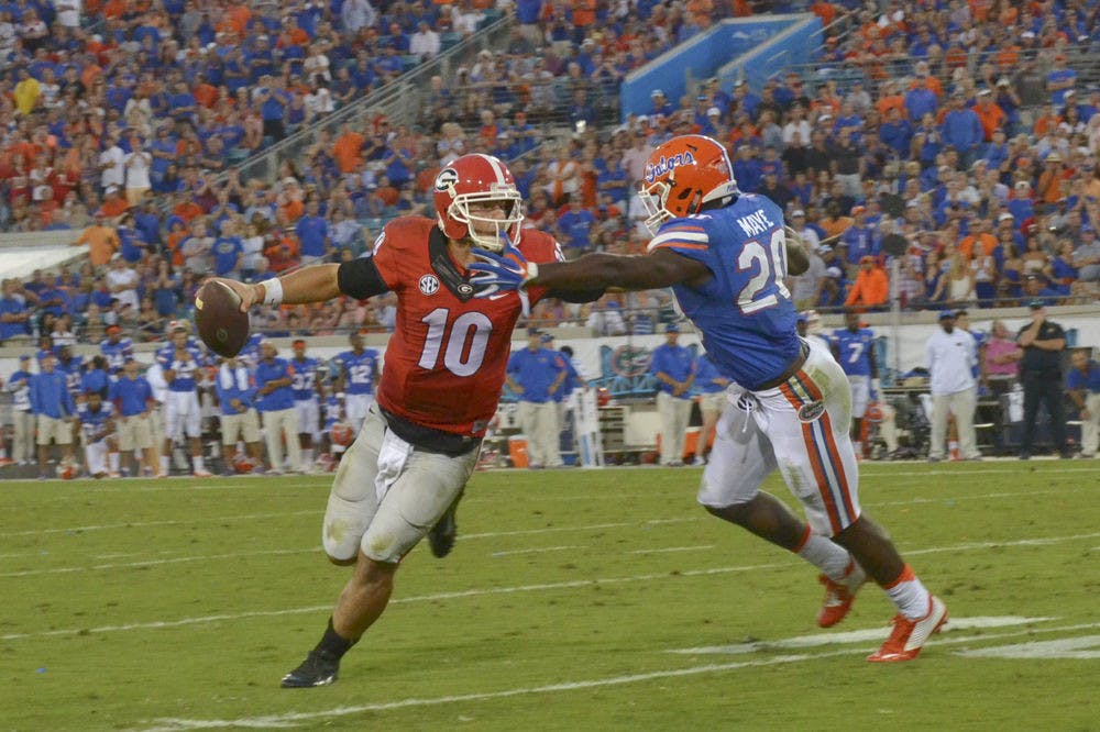 UF safety Marcus Maye attempts to tackle Georgia quarterback Faton Bauta (10) during Florida's 27-3 win against the Bulldogs on Oct. 31, 2015, at EverBank Field in Jacksonville.