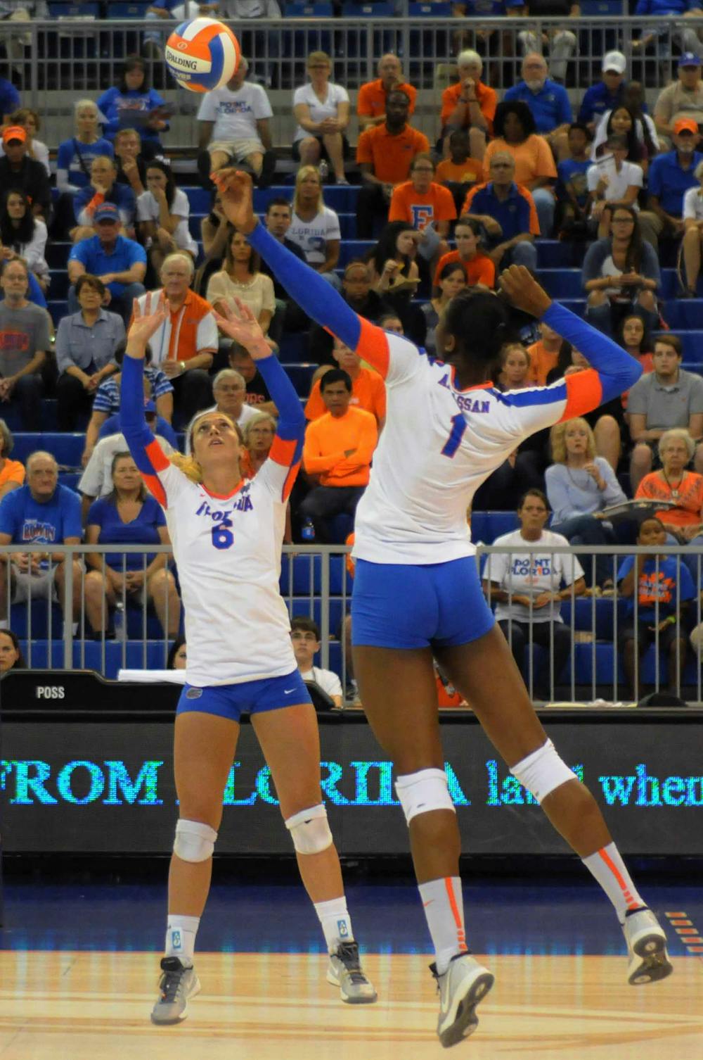<p>UF setter Mackenzie Dagostino (6) hits the ball up for middle blocker Rhamat Alhassan (1) during Florida's 3-0 win against St. John's on Sept. 17, 2015, in the O'Connell Center.</p>