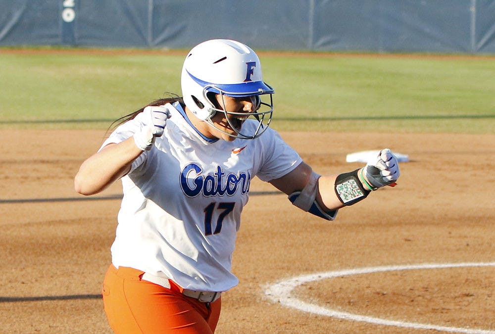 Florida's Lauren Haeger celebrates on the way home after hitting a home run in the first inning during the NCAA Women's College World Series Championship against Michigan in Oklahoma City, Monday.