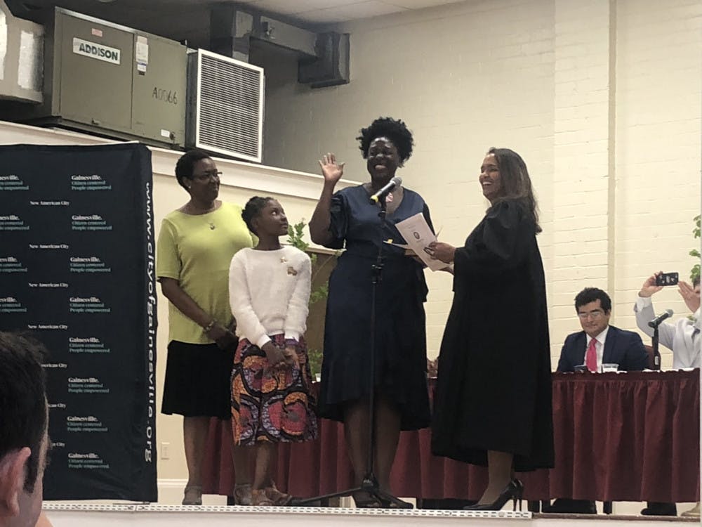 <p>Gail Johnson (center right) is sworn into office alongside her daughter <span id="docs-internal-guid-1dbc1107-7580-0847-78d0-144d0bb6a38f"><span>Zora (center left).</span></span></p>