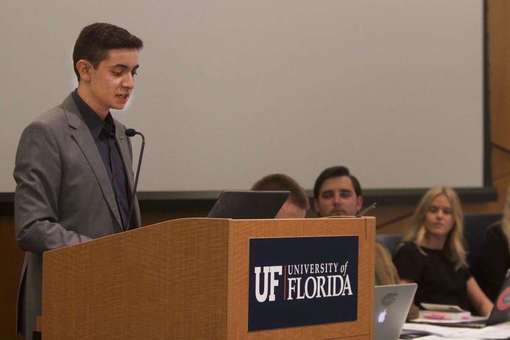 Mauricio Perez announces he is disaffiliating from the Impact Party during the final Student Government Senate meeting of the summer in the Reitz Union chamber room August 6. 
